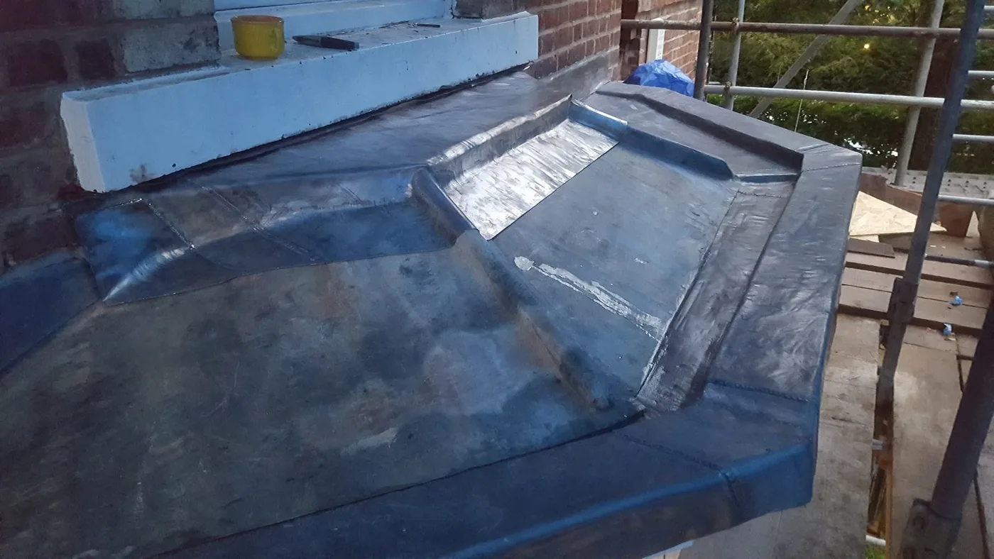 Bespoke welded lead detailing around a complex roof junction